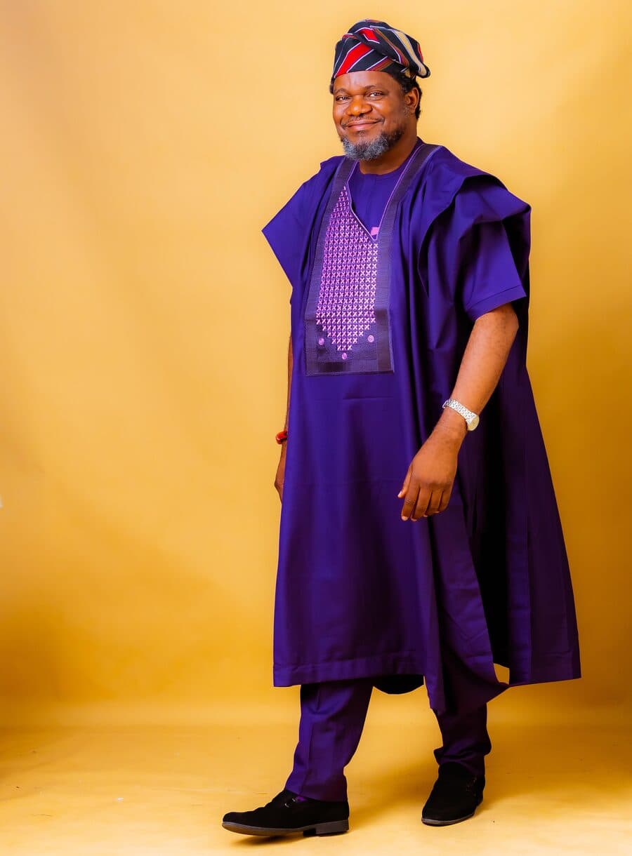 Full-length portrait of Dr. Olarewaju in traditional attire